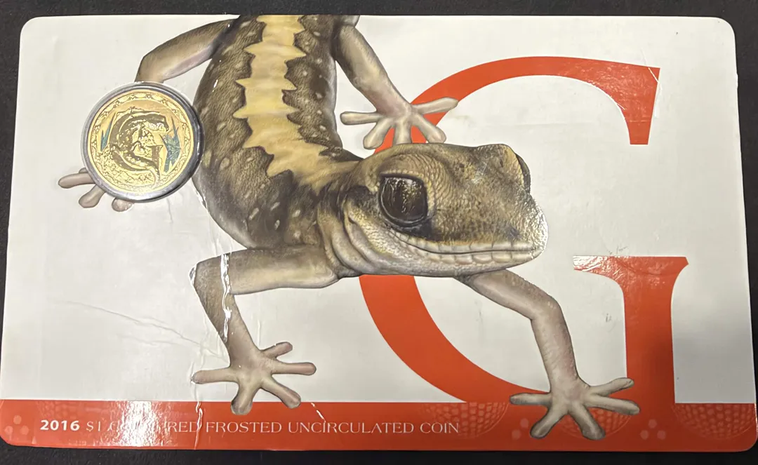 Lot 41 — 2016 $1 Alphabet G For Gecko Coloured Frosted Coin In Card